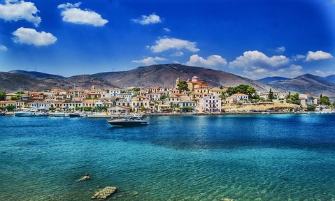 Discover sunny seaside towns perched on azure waters on a Greece yacht charter