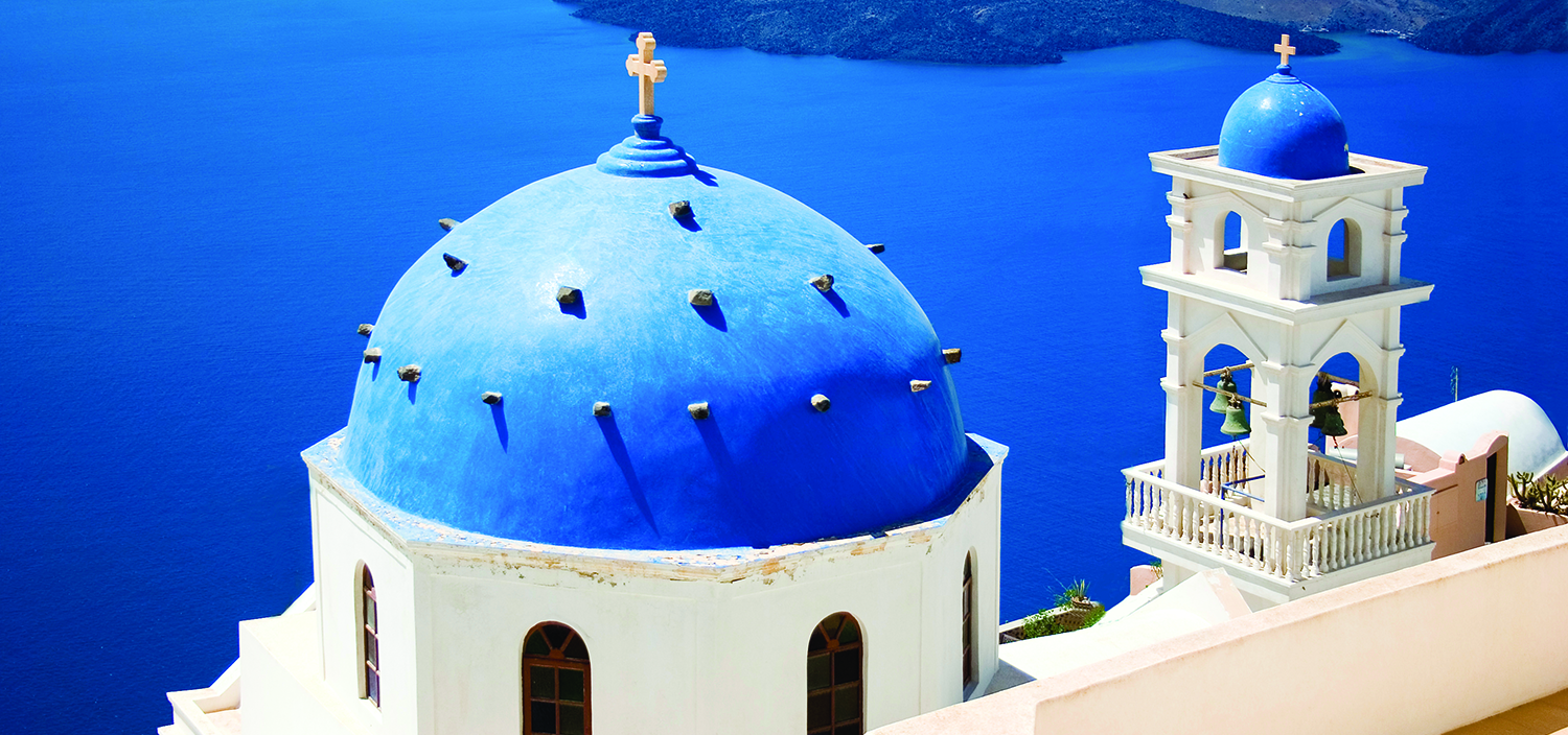 A Greece yacht charter with Fraser takes you past white churches with blue roofs